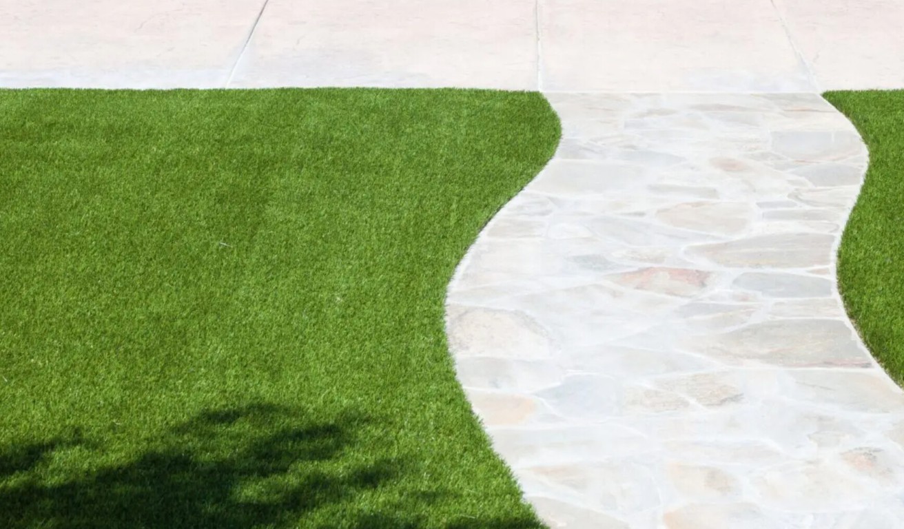 Perfect mud-free artificial lawn with paver walkway in Port Charlotte, FL